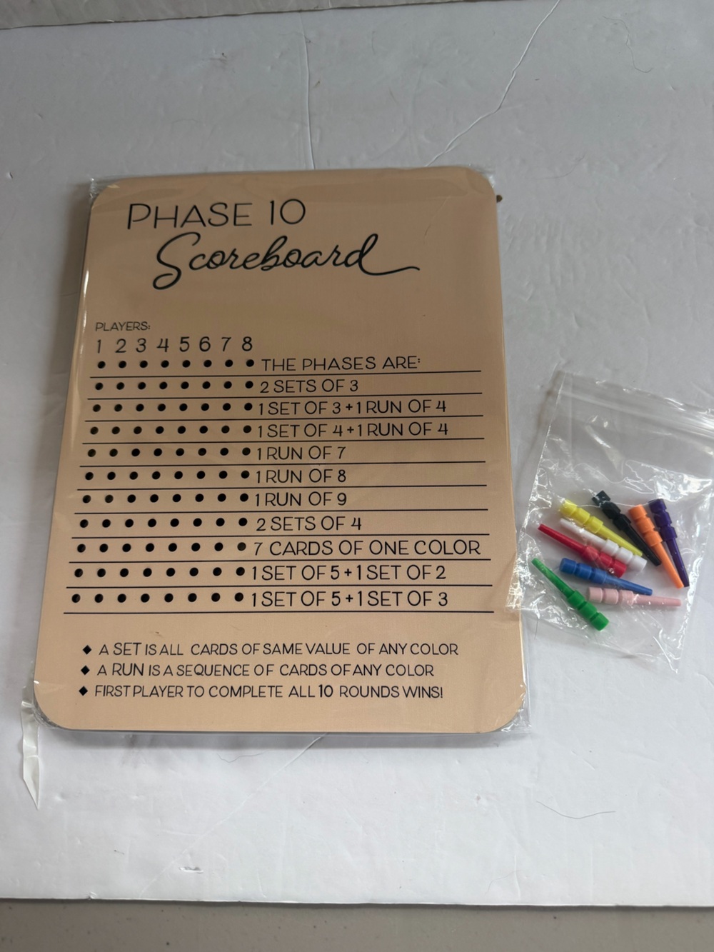 Phase 10 Scoreboard with Beige Board and Multicolored Pegs